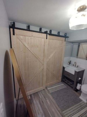 Custom Barn Doors - We removed the old existing door going to the closet in the bathroom. removed the casing and made the wall flat. Then custom built two barn doors to give the bathroom a nice little update. We also added a salon style door to the bar area. Custom Barn Doors - We removed the old existing door going to the closet in the bathroom. removed the casing and made the wall flat. Then custom built two barn doors to give the bathroom a nice little update. We also added a salon style door to the bar area.