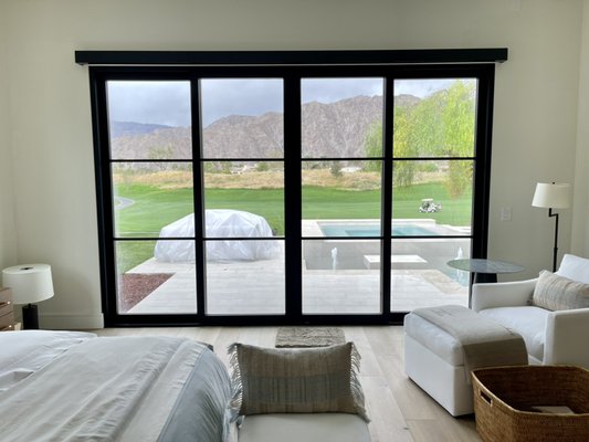 Indoor motorized shade installation in La Quinta - Custom motorized roller shades installed in La Quinta. Black fascia and blackout fabric