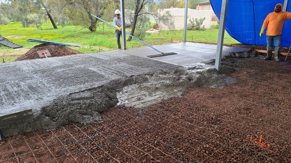 Pole barn hard trowel concrete floor - This was a neat pole barn floor that had to be leveled out, compacted prepped and poured out. We hard troweled it with machinery.