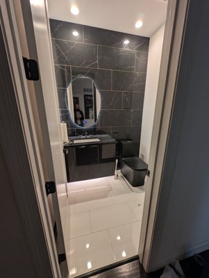 Powder room remodel - Hall bathroom that was updated with tile wall and new tile floors Powder room remodel - Hall bathroom that was updated with tile wall and new tile floors
