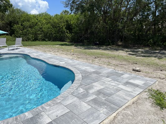 Pool landscape installation - Our poolside landscape installation enhances your outdoor oasis with lush greenery, vibrant plants, elegant hardscaping, and decorative rock or mulch for a polished look. We design with beauty, function, and durability in mind, incorporating tropical plants, pavers, and lighting to create a relaxing and inviting poolside retreat. Pool landscape installation - Our poolside landscape installation enhances your outdoor oasis with lush greenery, vibrant plants, elegant hardscaping, and decorative rock or mulch for a polished look. We design with beauty, function, and durability in mind, incorporating tropical plants, pavers, and lighting to create a relaxing and inviting poolside retreat.