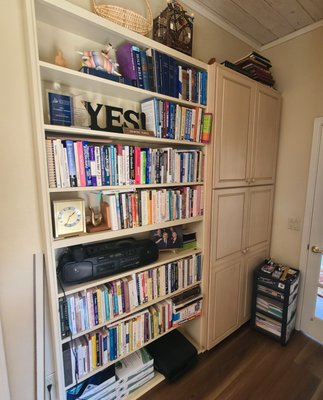 Home Office Bookshelf - My client uses her home office for client consultations and felt her space was overwhelming. Her first priority was dealing the bookshelf since this is the first thing you see when they walk in. There was outdated material that my client no longer uses, programs/workshops that she no longer teaches and references she no longer needed. Books were donated to a local bookstore, space was created on the shelf and the reading material was grouped together to make it easier to find. Home Office Bookshelf - My client uses her home office for client consultations and felt her space was overwhelming. Her first priority was dealing the bookshelf since this is the first thing you see when they walk in. There was outdated material that my client no longer uses, programs/workshops that she no longer teaches and references she no longer needed. Books were donated to a local bookstore, space was created on the shelf and the reading material was grouped together to make it easier to find.