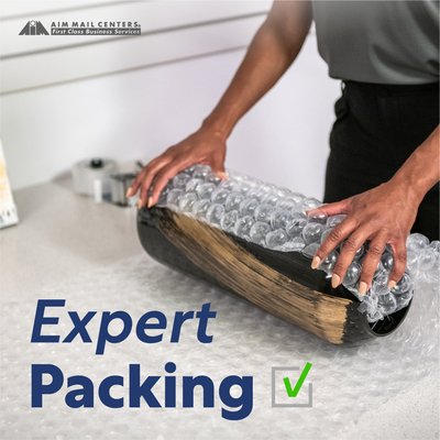 Packing Materials, we can help! - Whether you are a manufacturer, reseller, or supplier, AIM can help you pack your goods in the best way possible. We have various packing supplies that ensure your items reach your customers safe, secure, and intact.
The "AIM Packing Difference" involves working with our clients to ensure the packaging method enhances their business goals. Here are some of the packing materials we work with at AIM Mail Centers.
Paper Wrap: This type of packaging is made using pulp sourced from wood or other sources, such as bamboo or hemp. Many manufacturers use paper wraps to cover various products before shipping them out.
Bubble Packing: Bubble packing is a preferred method of packing various items. The wrap is typically made of a thin, transparent plastic material, which seals and covers items. Bubble packing is largely preferred for packaging easily breakable, sentimental, sensitive, or fragile items. The bubbles act as a cushion to protect items from scratches or breakage.
Cardboard/Fiberboard: Cardboard packaging is a popular practice because the material has three layers. There are two layers of liner on both ends and a wave layer in the middle. This construction offers plenty of cushioning and protection for the packaged items.
Cardboard also tends to be highly durable, puncture-proof, and crush-proof. Furthermore, it is relatively inexpensive to transport and store since it is collapsible and lightweight. When necessary, AIM builds custom boxes to fit shipments of all shapes and sizes.
Tape: Packing tape is an essential aspect of safe packing as they help seal packages and boxes. You could also use the adhesive tapes to bundle, wrap, and enclose items as you prepare to handle, store, and ship them. Packing Materials, we can help! - Whether you are a manufacturer, reseller, or supplier, AIM can help you pack your goods in the best way possible. We have various packing supplies that ensure your items reach your customers safe, secure, and intact.
The "AIM Packing Difference" involves working with our clients to ensure the packaging method enhances their business goals. Here are some of the packing materials we work with at AIM Mail Centers.
Paper Wrap: This type of packaging is made using pulp sourced from wood or other sources, such as bamboo or hemp. Many manufacturers use paper wraps to cover various products before shipping them out.
Bubble Packing: Bubble packing is a preferred method of packing various items. The wrap is typically made of a thin, transparent plastic material, which seals and covers items. Bubble packing is largely preferred for packaging easily breakable, sentimental, sensitive, or fragile items. The bubbles act as a cushion to protect items from scratches or breakage.
Cardboard/Fiberboard: Cardboard packaging is a popular practice because the material has three layers. There are two layers of liner on both ends and a wave layer in the middle. This construction offers plenty of cushioning and protection for the packaged items.
Cardboard also tends to be highly durable, puncture-proof, and crush-proof. Furthermore, it is relatively inexpensive to transport and store since it is collapsible and lightweight. When necessary, AIM builds custom boxes to fit shipments of all shapes and sizes.
Tape: Packing tape is an essential aspect of safe packing as they help seal packages and boxes. You could also use the adhesive tapes to bundle, wrap, and enclose items as you prepare to handle, store, and ship them.