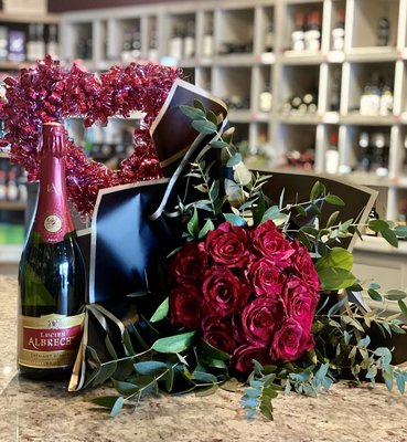 Valentine Special - This year, we are collaborating with AK Wine Grotto for a special pairing of roses and wine! 
Featuring one dozen premium red roses wrapped in "Ramo Buchon" style with your choice of 2 select bottles of wine: red, white and/or bubbly! Over $250 value for a special price of $199.99 *plus MOA tax
Pre-order now through February 13th! *Orders must be placed by phone only* All orders will be ready for pick up on February 13th & 14th between 12-8pm at: 
AK Wine Grotto 11109 Old Seward Hwy, Suite 2 Anchorage, AK 99515 Must have 21+ Valid ID