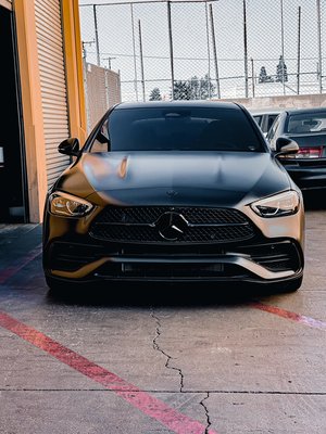 ‘22 Mercedes-Benz c300 wrapped in Satin Black. - This c300 was taken straight to us from the dealer ship and immediately wrapped in satin black along with a chrome delete and powder coated wheels. Customer wanted that stealthy aggressive look that satin black achieves