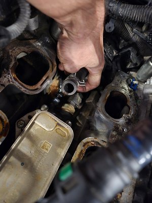 oil cooler replacment wrangler - customer had oil leak from oil cooler. removed intake manifolds, and cooler, replaced cooler and gaskets. Changed oil and coolant. oil cooler replacment wrangler - customer had oil leak from oil cooler. removed intake manifolds, and cooler, replaced cooler and gaskets. Changed oil and coolant.