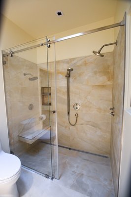 Granite Bay - Large Format Tile Shower Remodel - We recently completed an elegant walk-in shower, featuring beautiful lathe format faux marble tile and a sleek glass door. The result is a clean and sophisticated look that elevates the bathroom's aesthetic. Contact us for your next remodeling project and let us create the perfect space for you. Granite Bay - Large Format Tile Shower Remodel - We recently completed an elegant walk-in shower, featuring beautiful lathe format faux marble tile and a sleek glass door. The result is a clean and sophisticated look that elevates the bathroom's aesthetic. Contact us for your next remodeling project and let us create the perfect space for you.