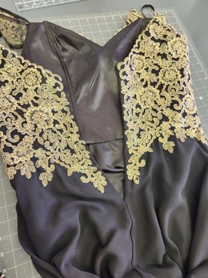 Invisible Zipper Replacement & Added Corset Style to add inches to this too small dress! - This customer brought in this dress that was too small and had a broken invisible zipper. We removed the broken zipper, added a new shorter zipper and added a corset style to give her 6'' extra inches to fit in this Mother Day Dress!