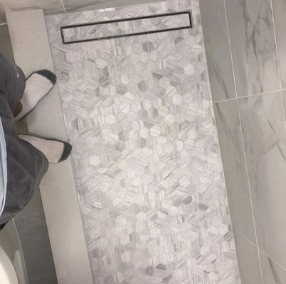 Full Bathroom Remodel - Bathroom remodel - linear drain - custom wet bed - hexagon mosaic tiles on floor - 12x24 white Carrara porcelain - custom niche - 60 inch vanity installation - plumbing - custom shower knobs Full Bathroom Remodel - Bathroom remodel - linear drain - custom wet bed - hexagon mosaic tiles on floor - 12x24 white Carrara porcelain - custom niche - 60 inch vanity installation - plumbing - custom shower knobs