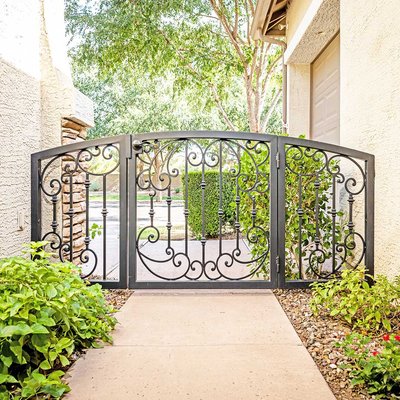 Iron & Wood Gates - Our custom designed residential security gates are handmade to match the style and color of your home, as well as to fit your budget. Our high quality wrought iron and wood entry gates are durable and decorative, improving curb appeal, and instantly adding property value to your home. Each wrought iron gate is built to withstand harsh weather conditions: both extreme sun and extreme cold. We also offer automatic gates with digital controls, electric gate openers and pneumatic closers. Your iron and wood gate will be built to fit your home’s custom design requirements. Whether you are looking for a wrought iron garden gate, a wrought iron driveway gate, or a composite or redwood gate for your backyard, First Impression Ironworks is here for you! Our iron and wood gates are perfect as:
Driveway Gates
Entrance Gates
Garden Gates
Entryway Gates
Pedestrian Gates
RV Gates
Courtyard Gates
Side Gates
Wood Panel Swing Gates