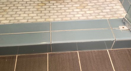 Broken glass tile in Shower - Replaced a couple of broken glass tiles in the entranceway to the shower Broken glass tile in Shower - Replaced a couple of broken glass tiles in the entranceway to the shower
