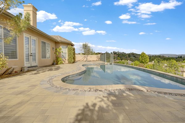 Escondido - Hardscape - a complete backyard hardscape project that involved installing pavers, flagstones, and remodeling a pool. The project transformed the backyard into a beautiful and functional outdoor living space, perfect for relaxing and entertaining.