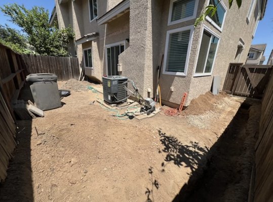 Back yard concrete installation - Client wanted a zero maintenance back yard with space so we installed a concrete slab for him with a small retaining wall