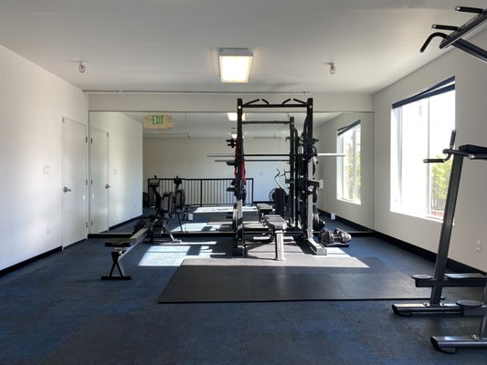 Individual Pod Reservation - Each Pod is equipped with all the equipment you need to build a thriving personal training business:
- Rack and platform
- Olympic barbell
- Hex bars
- 300 lbs of bumper plates
- Adjustable dumbbell block (up to 90 lbs)
- Resistance bands and chains
- Airdyne bikes and rowers Individual Pod Reservation - Each Pod is equipped with all the equipment you need to build a thriving personal training business:
- Rack and platform
- Olympic barbell
- Hex bars
- 300 lbs of bumper plates
- Adjustable dumbbell block (up to 90 lbs)
- Resistance bands and chains
- Airdyne bikes and rowers