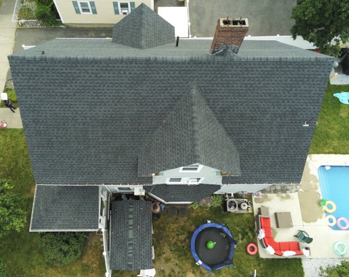 Replacement of Roof - Asphalt Shingle Roof. - The Asphalt Roof was replaced on the entire house. 
The existing roofing material was removed down to the sheeting and all the roof sheathing rotted was replaced. It was Installed new vents pipe flag boot to be properly flashed in with the new roof system, 6' ft of Ice & Water shield on the bottom & synthetic paper for other surfaces. Install new shingles GAF, style architectural with the color chosen by the owner, and installed a Roll ridge vent system on the peak of the house.
