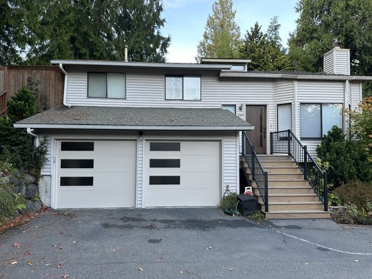 Modern steel garage doors with side lites/windows - Customer wanted to update the look of their home with new garage doors.