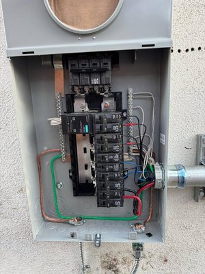 Main Electrical Panel Installation in a Residential Home — Los Angeles - This project involved replacing an old main electrical panel with a new 200-amp panel, including full rewiring, grounding, and electrical upgrades throughout the property. The work was completed at a private residence in Los Angeles, with on-site evaluation, technical documentation, and full compliance with NEC standards and LA city codes.

Scope of Work:

Removal of the old panel, power shutoff, and disconnection of outdated circuits

Surface preparation and outdoor wall mounting of the new panel

Installation of a new 200A main panel with properly labeled breakers

Running new branch circuits, installing grounding, GFCI, and ARC fault breakers

Testing of circuits, phases, neutral connections, and NEC code compliance

Connection to utility power (temporary and permanent), full functionality testing

Final inspection approved and signed off by city inspector

Client Search Intent:

"replace main breaker panel Los Angeles"

"install 200 amp electrical panel in home"

"licensed electrician Tesla panel upgrade"

"upgrade old electrical panel in house"

"main panel installation with permit LA"

Outcome:
The result is a modern, safe, and code-compliant main panel, ready to handle future high-demand loads, including a Tesla Wall Connector and home generator. The project was completed on time with no issues. The panel was labeled, sealed, and all branch circuits were clearly identified and documented.