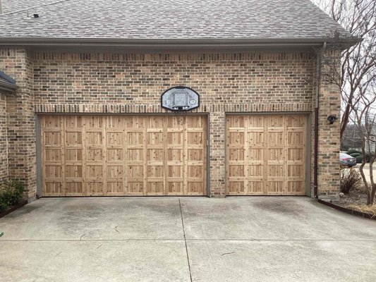 Western Red Tight Knot Cedar Garage Doors - One of the benefit of wooden doors is the flexibility on designs and color! Our Cedar garage doors are custom made in Blue Ridge, TX by All American Garage Doors! This customer chose the Western Red Tight-Knot Cedar, and it looks fantastic on their home! The doors come kiln-dried and unstained so they can be stained and sealed to your liking! Ready for an upgrade? Contact us today for your free on-site estimate! You can reach us at (972)-422-1695 or PlanoOverhead.com/contact-us/ Western Red Tight Knot Cedar Garage Doors - One of the benefit of wooden doors is the flexibility on designs and color! Our Cedar garage doors are custom made in Blue Ridge, TX by All American Garage Doors! This customer chose the Western Red Tight-Knot Cedar, and it looks fantastic on their home! The doors come kiln-dried and unstained so they can be stained and sealed to your liking! Ready for an upgrade? Contact us today for your free on-site estimate! You can reach us at (972)-422-1695 or PlanoOverhead.com/contact-us/