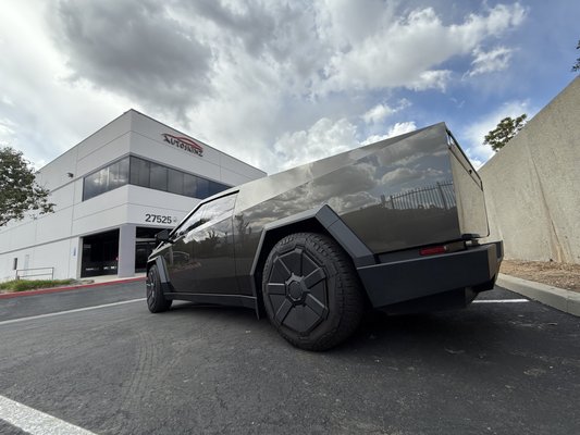 2025 Cybertruck - This Cybertruck was wrapped in colored PPF. Color is called Platinum. The windows were tinted in our ceramic window film. 20% on the sides/rear and 70% on the windshield for maximum heat rejection.