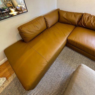 Leather Sofa Restoration with Partial Reupholstery - This sectional required more than cosmetic repair. The seat cushions were heavily worn and cracked, making leather replacement necessary on the most damaged sections.
We sourced new leather that closely matched the original in texture and appearance and replaced the seating panels while preserving the rest of the sofa.
Due to long-term sun exposure, the remaining leather had faded unevenly. After the new panels were installed, we performed full color correction and leather dyeing across the entire sectional to restore a consistent, balanced look.
The result is a refreshed sofa with renewed seating surfaces, even color throughout, and extended lifespan — without full reupholstery or replacement. Leather Sofa Restoration with Partial Reupholstery - This sectional required more than cosmetic repair. The seat cushions were heavily worn and cracked, making leather replacement necessary on the most damaged sections.
We sourced new leather that closely matched the original in texture and appearance and replaced the seating panels while preserving the rest of the sofa.
Due to long-term sun exposure, the remaining leather had faded unevenly. After the new panels were installed, we performed full color correction and leather dyeing across the entire sectional to restore a consistent, balanced look.
The result is a refreshed sofa with renewed seating surfaces, even color throughout, and extended lifespan — without full reupholstery or replacement.