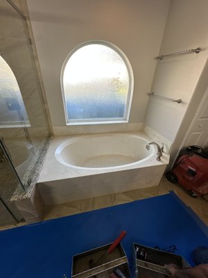 Deck tub to freestanding conversion - We were blessed with an opportunity that really tested our abilities. Removed an exisintg deck tub, relocated the drain and waterlines to the center of the alcove. Installed this beautiful Kingston Brass cast iron tub and floor mount filler valve. The tub was 72 inches in width and the alcove was 73in. Taking into consideration the weight of this almost 700lb monster it goes without saying we had to hit our mark, and we did! Deck tub to freestanding conversion - We were blessed with an opportunity that really tested our abilities. Removed an exisintg deck tub, relocated the drain and waterlines to the center of the alcove. Installed this beautiful Kingston Brass cast iron tub and floor mount filler valve. The tub was 72 inches in width and the alcove was 73in. Taking into consideration the weight of this almost 700lb monster it goes without saying we had to hit our mark, and we did!