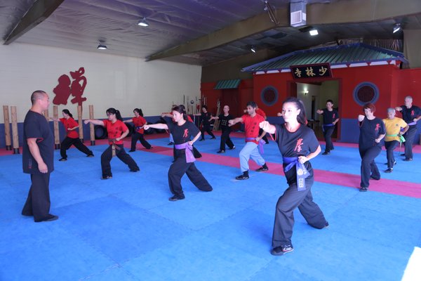 Adult Shaolin Kung Fu - Designed for adults seeking strength, discipline, and balance, our Adult Shaolin Kung Fu program combines traditional Shaolin techniques with modern training principles. Classes focus on flexibility, coordination, conditioning, and mental focus through structured forms, drills, and mindful practice. Suitable for all experience levels, this program supports physical fitness, stress reduction, and long-term personal growth in a respectful, supportive environment. Adult Shaolin Kung Fu - Designed for adults seeking strength, discipline, and balance, our Adult Shaolin Kung Fu program combines traditional Shaolin techniques with modern training principles. Classes focus on flexibility, coordination, conditioning, and mental focus through structured forms, drills, and mindful practice. Suitable for all experience levels, this program supports physical fitness, stress reduction, and long-term personal growth in a respectful, supportive environment.
