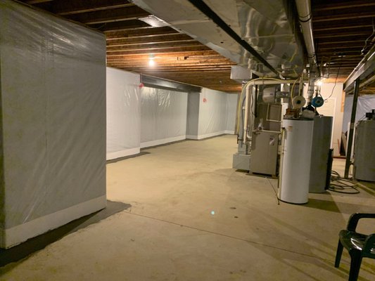 Basement Waterproofing Prior to a Remodel - This basement was leaking and needed interior drainage and wall liner.  The drainage takes care of hydrostatic pressure and the liner protects insulation, framing, and drywall from any water leaks through the walls.