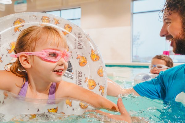 KIDS CLASSES - Starting at age 4 and above you can register your child for one of our Kid-level swimming classes. We offer 11 distinct levels, each tailored with unique milestones for progression. Every child begins at the level that aligns with their age and skill set, advancing as their instructor provides milestone updates. KIDS CLASSES - Starting at age 4 and above you can register your child for one of our Kid-level swimming classes. We offer 11 distinct levels, each tailored with unique milestones for progression. Every child begins at the level that aligns with their age and skill set, advancing as their instructor provides milestone updates.