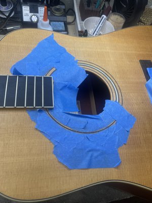 Rosette Crack Repair - This acoustic had a crack forming in the rosette that was invisible to the naked eye but could be seen after a brief inspection. The crack has been filled with a 1.5 mm veneer to bring some extra strength to the forming crack and ensure it doesnt spread any further. Rosette Crack Repair - This acoustic had a crack forming in the rosette that was invisible to the naked eye but could be seen after a brief inspection. The crack has been filled with a 1.5 mm veneer to bring some extra strength to the forming crack and ensure it doesnt spread any further.