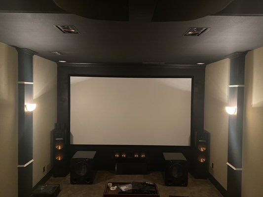 Amazing Home Theater Setup! - This media room was a refresh where we upgraded the projector from 1080p to native 4K, sized up the screen from a 120” to a 155” display, retro wired 4 additional speakers for Atmos, and upgraded the integrated receiver with a separate tuner and power amplifier to really rock the room.