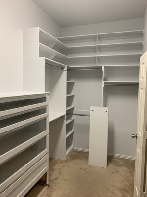 Designed for the dress.  Dream Closet Remodel with hidden shelves - The focus of this project was the wedding dress, which we added track lighting to feature.  Also included hidden shoes and a glass front dresser, all custom based on the customers wants and needs.