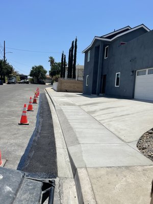Driveways - This client wanted to remodel the drive way and home entrance area. We demolished, removed, graded and installed new concrete driveway, curb & gutter, asphalt patch back, walkways etc. Driveways - This client wanted to remodel the drive way and home entrance area. We demolished, removed, graded and installed new concrete driveway, curb & gutter, asphalt patch back, walkways etc.