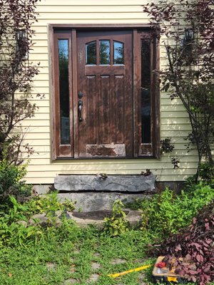 Front door and threshold replacement. - Floor was routed out from improper installation.