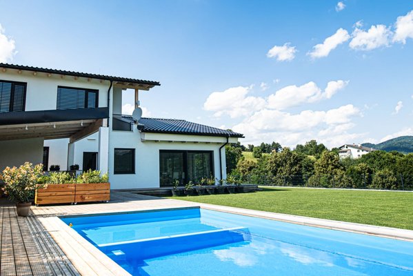 Outdoor Living Transformation - We completely transformed this outdoor space to create a beautiful, multi-functional backyard perfect for relaxing and entertaining. The project features lush artificial turf, custom concrete pathways, ambient lighting, a firepit lounge, outdoor dining area, and a stunning poolside view. Each element was carefully designed to enhance both the aesthetic and usability of the yard, creating a seamless flow between nature and comfort. Outdoor Living Transformation - We completely transformed this outdoor space to create a beautiful, multi-functional backyard perfect for relaxing and entertaining. The project features lush artificial turf, custom concrete pathways, ambient lighting, a firepit lounge, outdoor dining area, and a stunning poolside view. Each element was carefully designed to enhance both the aesthetic and usability of the yard, creating a seamless flow between nature and comfort.