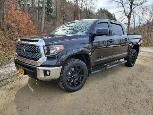2018 Toyota Tundra paint correction and ceramic coating - This truck came to us in decent shape but as a hunter the owner has had it in the woods and had not practiced correct washing methods that should be followed to prevent swirl marks in the paints finish. We did a 5 stage buff and ceramic coating to take this truck past the way it looked when the customer bought it. The green, purple and blue metallic really shined thru and popped after we were done. All of the fender flares and wheels were taken off to be able to properly detail all aspects of this truck! 2018 Toyota Tundra paint correction and ceramic coating - This truck came to us in decent shape but as a hunter the owner has had it in the woods and had not practiced correct washing methods that should be followed to prevent swirl marks in the paints finish. We did a 5 stage buff and ceramic coating to take this truck past the way it looked when the customer bought it. The green, purple and blue metallic really shined thru and popped after we were done. All of the fender flares and wheels were taken off to be able to properly detail all aspects of this truck!