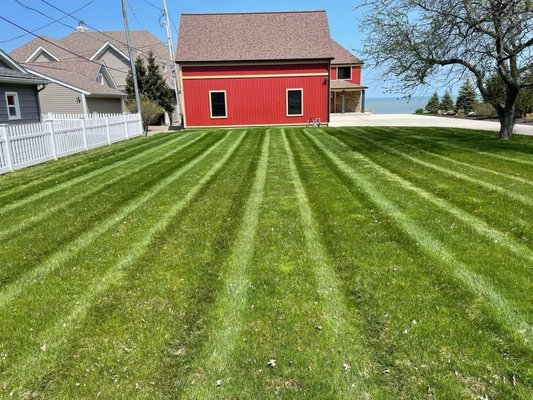 LAWN SERVICES - Keep your lawn looking pristine with Green Man Lawn Care's professional mowing services, tailored to give you a perfectly manicured yard all season long!