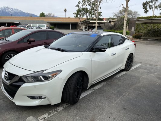 Nissan Maxima - Windshield replacement and door glass replacement before and after.