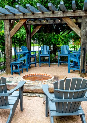 Barn Beam Pergola - Alterra was engaged to design and install an outdoor living area for what seemed at the time would be just another really nice project. Little did we know that this project would turn out to be one of the most amazing and special projects we have ever done. All of us at Alterra are truly grateful to have done this project for such an incredible client. The initial goal was to design and build an outdoor living space that would enhance an already beautiful property in North Dallas. The client wanted a pergola, fire-pit, sitting area and screening to block the street view along with custom lighting. Her vision was to create a less formal space for the family to gather and feel like they were out of town camping. During subsequent conversations Alterra learned that the client had once been an orphan and was in foster homes until finally being adopted. The client also told us she how much she loved barn beams and timber frame structures. That led to the eventual sourcing of circa 1820 barn beams that had been salvaged from an old orphanage in Pennsylvania. The beams were shipped to Dallas where Alterra build-teams fabricated the pergola using timber framing methods and joints (there are no modern metal fasteners used). The space is now a very special place where the client can retreat with her family (husband and 6 children) and when she talks about her pergola and the special outdoor space it shelters, the story brings tears of joy!