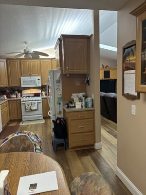 Kitchen Remodel - This remodel was completed on an old kitchen that needed updating. Added new ceiling lights, cabinets, quartz tops and an island.  Updated the laundry with matching cabinetry.