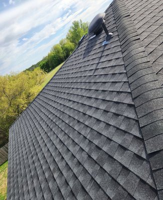 Shingle Roof Replacement - This comprehensive shingle roofing project in Elgin transformed an aging roof with GAF's premium Timberline HDZ system, engineered specifically for Texas's harsh climate conditions. The installation included complete removal and disposal of old materials, strategic decking replacement with 7/16" OSB, and GAF FeltBuster synthetic underlayment for superior moisture protection. Our crew navigated the challenging two-story access requirements while installing GAF StormGuard ice and water shield in critical areas, ensuring this home can handle everything from 100-degree summers to severe hail storms that frequently impact the Elgin area.