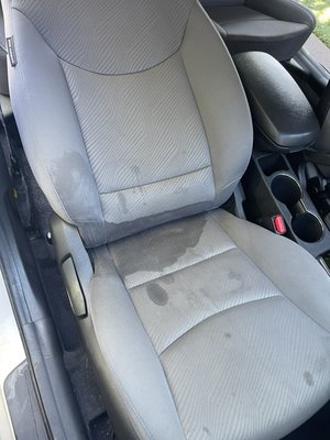 Fabric Seat Deep Cleaning - This vehicle had a very unpleasant smell due to juice being spilled on the seat making it's way to the carpet. We began our process by thoroughly vacuuming the vehicle, then we used a steam cleaner to kill any mold that may've developed, shampoo, extract, repeat until everything was clean.

It's very important to keep your vehicle's interior clean to provide better driving conditions and kill as much bacteria as possible.