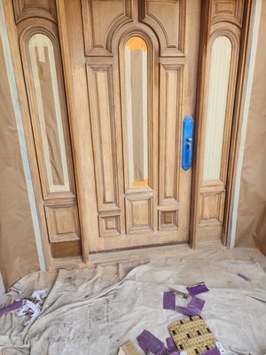 Front door restaining - This was a front door that had the old stain damaged by the weather so we started by sanding down to the raw wood to remove the damages. We then applied the stain and finished it one with 3 coats of protective clear to make a smooth long lasting finish. At the end we brought back life to the beautiful wood underneath.
