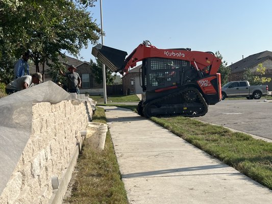 Retaining wall - This was a retaining wall construction for a customer who had erosion due to grade. We were able create a retainer for the new soil. Retaining wall - This was a retaining wall construction for a customer who had erosion due to grade. We were able create a retainer for the new soil.
