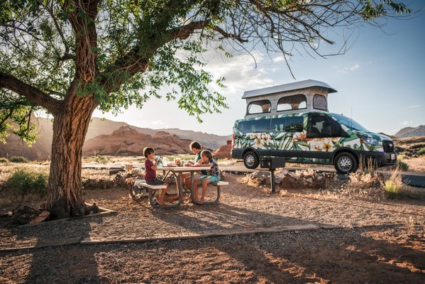Mesa Camper Van - Adventure meets comfort with our Mesa camper van, designed for road trippers who want to explore the great outdoors without sacrificing convenience. Whether you're embarking on your first van life experience or are a seasoned road tripper, the Mesa offers the perfect balance of space, functionality, and style.The Mesa model is perfect for any season, with a well-equipped kitchenette, cozy sleeping space, and plenty of storage for your gear. This custom hand-painted camper van is built for up to five travelers with the rooftop sleeper add on, making it ideal for couples, families, or small groups. With smart storage solutions and a thoughtful design, you’ll have everything you need for a seamless journey. Whether you're waking up to alpine sunrises or winding down after a day of exploring, this van ensures your road trip is as seamless as it is unforgettable.Looking to check off your bucket list in style? Rent the Mesa today and experience van life with Escape Camper Vans! Mesa Camper Van - Adventure meets comfort with our Mesa camper van, designed for road trippers who want to explore the great outdoors without sacrificing convenience. Whether you're embarking on your first van life experience or are a seasoned road tripper, the Mesa offers the perfect balance of space, functionality, and style.The Mesa model is perfect for any season, with a well-equipped kitchenette, cozy sleeping space, and plenty of storage for your gear. This custom hand-painted camper van is built for up to five travelers with the rooftop sleeper add on, making it ideal for couples, families, or small groups. With smart storage solutions and a thoughtful design, you’ll have everything you need for a seamless journey. Whether you're waking up to alpine sunrises or winding down after a day of exploring, this van ensures your road trip is as seamless as it is unforgettable.Looking to check off your bucket list in style? Rent the Mesa today and experience van life with Escape Camper Vans!