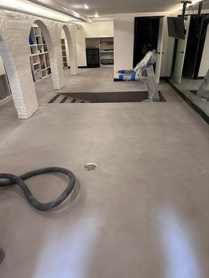 Micro-topping Top Coating - We did a residential basement floor that had a water leak and damaged there old micro topping. We needed to remove the old finish and apply a new one to match the old one. Micro-topping Top Coating - We did a residential basement floor that had a water leak and damaged there old micro topping. We needed to remove the old finish and apply a new one to match the old one.