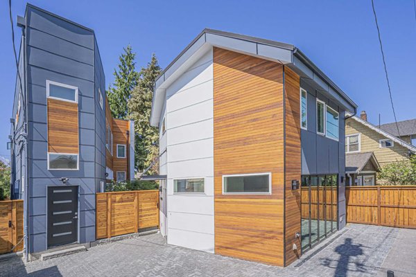 DADU in Seattle - 2 Bedrooms, 2 Bathrooms - We completed this two-story, 863 sq. ft. backyard DADU in Seattle using the Roy floor plan — designed to mirror the angular geometry of the existing main residence while maximizing space, function, and parking.

The ground-level flexible living area opens directly into a private east-facing courtyard, offering seamless indoor-outdoor flow and additional privacy. Upstairs, thoughtfully placed windows frame beautiful tree-lined views, making the space feel both cozy and connected to nature.

This compact yet highly functional unit features:

Two bedrooms and two full bathrooms

Modern open-layout ground floor

Dynamic roofline and custom angles

Integrated courtyard access

Smart use of space on a tight Seattle lot

Completed in August 2021, the Roy DADU is a great example of how small-scale infill development can blend clean design with livability, privacy, and long-term value.
