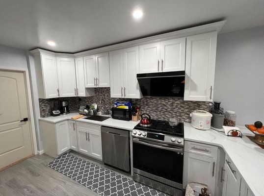 White Shaker Set with L-shape Island - This kitchen was done in 2021, the cabinet is between a shaker and traditional style, so it has more of a homey feel but still much easier to clean than actual traditional styles with many intricate grooves in the design. White Shaker Set with L-shape Island - This kitchen was done in 2021, the cabinet is between a shaker and traditional style, so it has more of a homey feel but still much easier to clean than actual traditional styles with many intricate grooves in the design.
