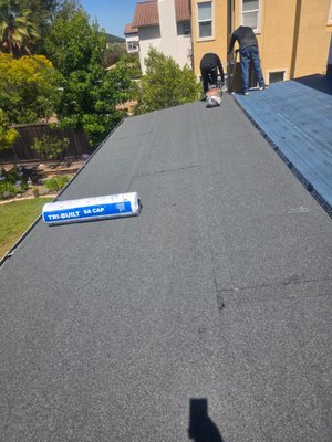 Self-Adhered Flat Roof Replacement - We replaced a section of this residential flat roof that had reached the end of its service life. The existing roofing materials were removed, the roof deck was inspected, and a new self-adhered modified bitumen roofing system was installed to restore a watertight, durable surface. The project was completed with careful attention to detail to ensure a seamless transition with the existing roof and long-lasting protection. Self-Adhered Flat Roof Replacement - We replaced a section of this residential flat roof that had reached the end of its service life. The existing roofing materials were removed, the roof deck was inspected, and a new self-adhered modified bitumen roofing system was installed to restore a watertight, durable surface. The project was completed with careful attention to detail to ensure a seamless transition with the existing roof and long-lasting protection.