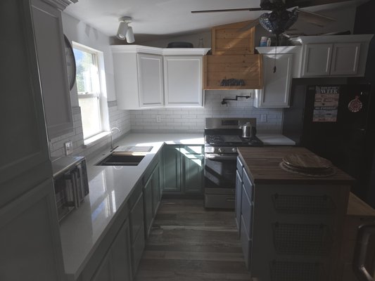 Bathroom & Kitchen Remodel - This bathroom and kitchen remodel was a sparked by the need for water damage remediation and demolition due to a leak from the existing water pipes. The house was re-piped and the kitchen and bathroom renovated with style!