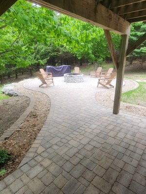 Paver Patio And Stone fire pit - This customer wanted to finish the landscaping all the way around the house. We built him this paver patio so he could set a hot tub out there under his deck, leading out to a paver patio surrounding a raised Chilton limestone fire pit. We also installed paver edging and mulch around the whole house. Paver Patio And Stone fire pit - This customer wanted to finish the landscaping all the way around the house. We built him this paver patio so he could set a hot tub out there under his deck, leading out to a paver patio surrounding a raised Chilton limestone fire pit. We also installed paver edging and mulch around the whole house.